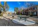 Park-like common area featuring picnic tables and grilling area for residents at 1505 Blackcombe St # 202, Las Vegas, NV 89128