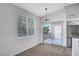 Cozy dining area featuring plush carpeting, natural light, and access to an outdoor patio at 1505 Blackcombe St # 202, Las Vegas, NV 89128