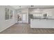 Inviting dining area featuring plush carpeting, natural light, and access to an outdoor patio at 1505 Blackcombe St # 202, Las Vegas, NV 89128