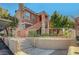 Inviting exterior of an apartment building featuring manicured landscaping and stair access to upper units at 1505 Blackcombe St # 202, Las Vegas, NV 89128