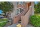 Exterior of an apartment building with well-maintained landscaping and a stairwell to the upper units at 1505 Blackcombe St # 202, Las Vegas, NV 89128