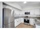 Spacious kitchen showcasing white cabinetry, stainless steel appliances, and stylish countertops for a modern look at 1505 Blackcombe St # 202, Las Vegas, NV 89128