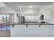 Modern kitchen with stainless steel appliances, granite countertops, and ample cabinet space at 1505 Blackcombe St # 202, Las Vegas, NV 89128