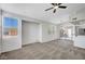Spacious living room with natural light, plush carpeting, and access to the outdoors at 1505 Blackcombe St # 202, Las Vegas, NV 89128