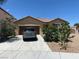 Charming single-story home with a low-maintenance landscape and long driveway to a two car garage at 152 Lotus Vale Ave, Las Vegas, NV 89123