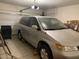 Spacious garage with a silver minivan, providing ample parking and storage at 152 Lotus Vale Ave, Las Vegas, NV 89123
