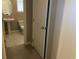 Hallway view leading to a washroom with a pedestal sink at 152 Lotus Vale Ave, Las Vegas, NV 89123