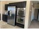 Kitchen featuring stainless steel appliances including refrigerator and built-in ovens at 152 Lotus Vale Ave, Las Vegas, NV 89123