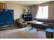A second living room area with a table, recliner, and shelving unit at 152 Lotus Vale Ave, Las Vegas, NV 89123