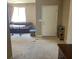 Open-concept living room with carpet and plenty of natural light at 152 Lotus Vale Ave, Las Vegas, NV 89123