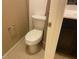 Toilet next to a tiled wall and vanity, inside the bathroom at 152 Lotus Vale Ave, Las Vegas, NV 89123