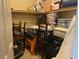 View into the cluttered walk-in closet featuring shelves and an assortment of items at 152 Lotus Vale Ave, Las Vegas, NV 89123