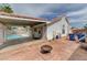 Backyard featuring a pool, covered patio, and fire pit, designed for outdoor entertainment and relaxation at 1523 Silver Point Ave, Las Vegas, NV 89123