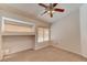 Bedroom with tile flooring, ceiling fan, and window with blinds at 1523 Silver Point Ave, Las Vegas, NV 89123