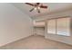 Bedroom with tile floor, ceiling fan, and large window at 1523 Silver Point Ave, Las Vegas, NV 89123