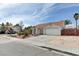 Charming single-story home with a well-manicured front yard and long driveway at 1523 Silver Point Ave, Las Vegas, NV 89123