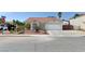 Charming single-story home with a two car garage, low maintenance desert landscaping, and a long driveway at 1523 Silver Point Ave, Las Vegas, NV 89123