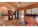 Updated kitchen with stainless steel appliances, slate tile floors, and a sliding door to backyard at 1523 Silver Point Ave, Las Vegas, NV 89123