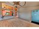 Spacious living area with wood floors, high ceilings, and a view of the entry with a blue front door at 1523 Silver Point Ave, Las Vegas, NV 89123