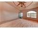 Open living room featuring wood floors, lots of light, and an interesting ceiling fan at 1523 Silver Point Ave, Las Vegas, NV 89123