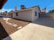 Private backyard with stepping stones and a concrete patio at 1832 Yellow Rose St, Las Vegas, NV 89108