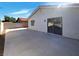 An extended concrete patio and enclosed backyard for outdoor activities at 1832 Yellow Rose St, Las Vegas, NV 89108