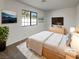 Comfortable bedroom with a large window and modern decor at 1832 Yellow Rose St, Las Vegas, NV 89108