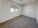 Comfortable bedroom with neutral carpeting and a window at 1832 Yellow Rose St, Las Vegas, NV 89108
