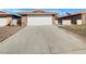 Charming single-story home featuring a two-car garage and stone accents at 1832 Yellow Rose St, Las Vegas, NV 89108