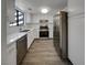 Modern kitchen with stainless steel appliances, white cabinets, and quartz countertops at 1832 Yellow Rose St, Las Vegas, NV 89108