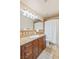 Bathroom featuring beautiful wood cabinetry, granite counters, and shower at 1845 Candle Bright Dr, Henderson, NV 89074