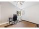 Bright bedroom with a desk, ceiling fan, and natural light streaming through the windows at 1845 Candle Bright Dr, Henderson, NV 89074