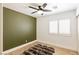 Bedroom with light wood floors, shutters on window, and ceiling fan at 1845 Candle Bright Dr, Henderson, NV 89074