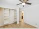 Bedroom featuring wood flooring, an open closet, and ensuite bathroom at 1845 Candle Bright Dr, Henderson, NV 89074