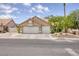 Charming single-story home featuring a two-car garage and well-maintained desert landscaping at 1845 Candle Bright Dr, Henderson, NV 89074