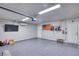 Spacious garage featuring epoxy floors, TV, and ample storage space at 1845 Candle Bright Dr, Henderson, NV 89074