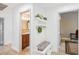 Hallway with a decorated bench leading to the bathroom and bedroom at 1845 Candle Bright Dr, Henderson, NV 89074