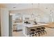 Stylish open-concept kitchen featuring a central island with seating and stainless steel appliances at 1845 Candle Bright Dr, Henderson, NV 89074
