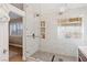 Modern walk-in shower features a glass door, shower head, and built-in shelving at 1845 Candle Bright Dr, Henderson, NV 89074