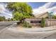 Community entrance with brick wall, landscaping and signage on corner lot by crosswalk at 1845 Candle Bright Dr, Henderson, NV 89074