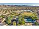 Aerial view of a well-maintained community with recreation areas and stunning mountain views in the distance at 1921 Spyglass Dr, Henderson, NV 89074