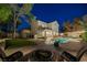 Beautiful backyard features a pool, fire pit, and outdoor seating area perfect for entertaining at 1921 Spyglass Dr, Henderson, NV 89074