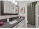 Modern bathroom with a gray countertop, white cabinetry, and stylish fixtures at 1921 Spyglass Dr, Henderson, NV 89074