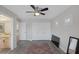 Bedroom boasts a ceiling fan, plank floors, and ample closet space for storage at 1921 Spyglass Dr, Henderson, NV 89074