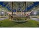 Grand Legacy entrance with lush flowers, meticulous landscaping, and stately palms at 1921 Spyglass Dr, Henderson, NV 89074