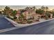 Beautiful two-story home with a tile roof, mature trees, and a well-maintained landscape at 1921 Spyglass Dr, Henderson, NV 89074