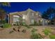 Charming two-story home with stone accents, a three-car garage, and desert landscaping at 1921 Spyglass Dr, Henderson, NV 89074