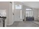 Bright and airy foyer with high ceilings, modern lighting, and wood-look flooring at 1921 Spyglass Dr, Henderson, NV 89074