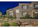 Stunning front entrance with stone accents, decorative windows and meticulous landscaping with stone steps at 1921 Spyglass Dr, Henderson, NV 89074