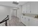 Hallway featuring built-in cabinets, offering plenty of storage, and a view of the hallway at 1921 Spyglass Dr, Henderson, NV 89074